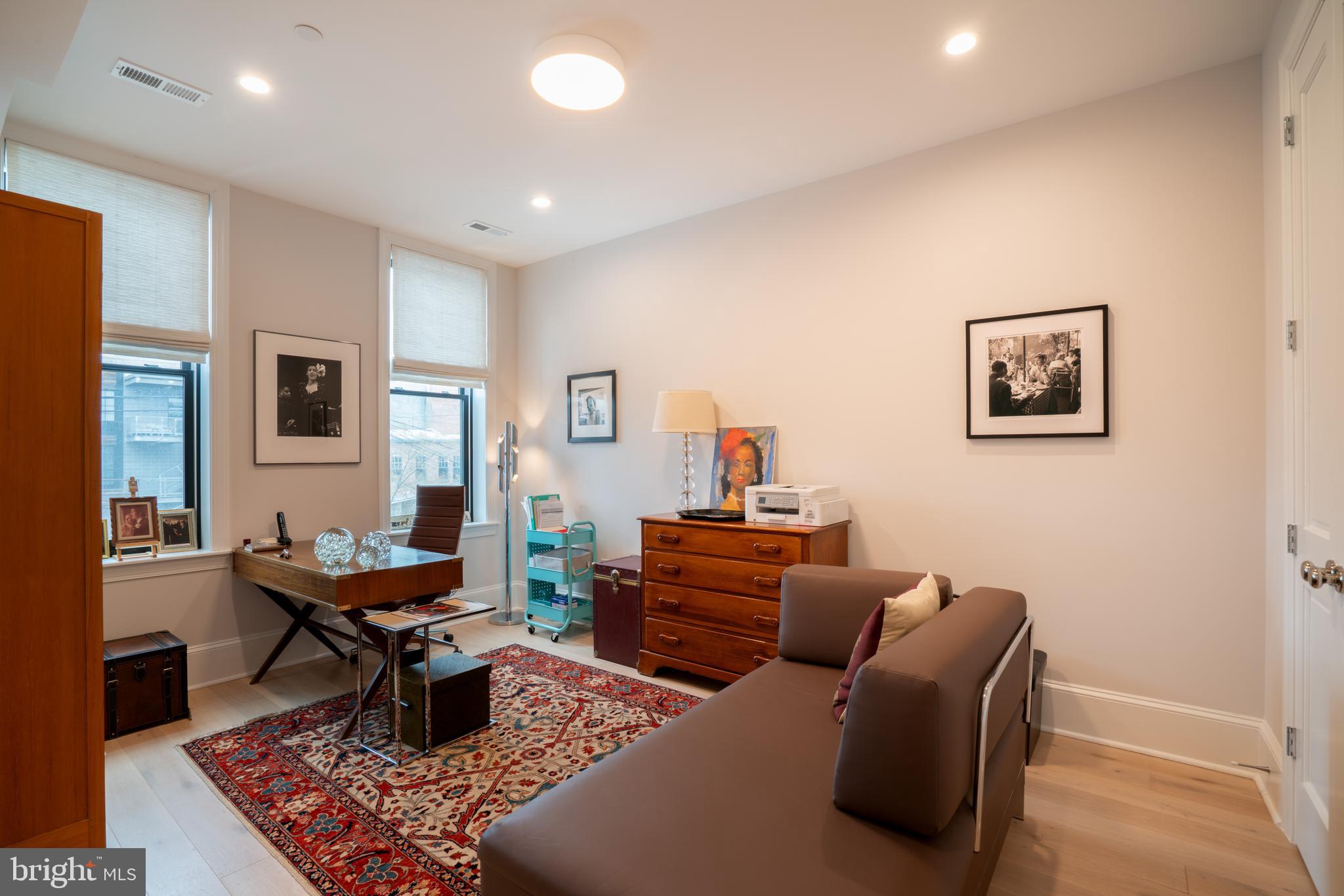 911 M Street Northwest Washington, DC 20001 - Photo 11 of 31 a living room with furniture and a window