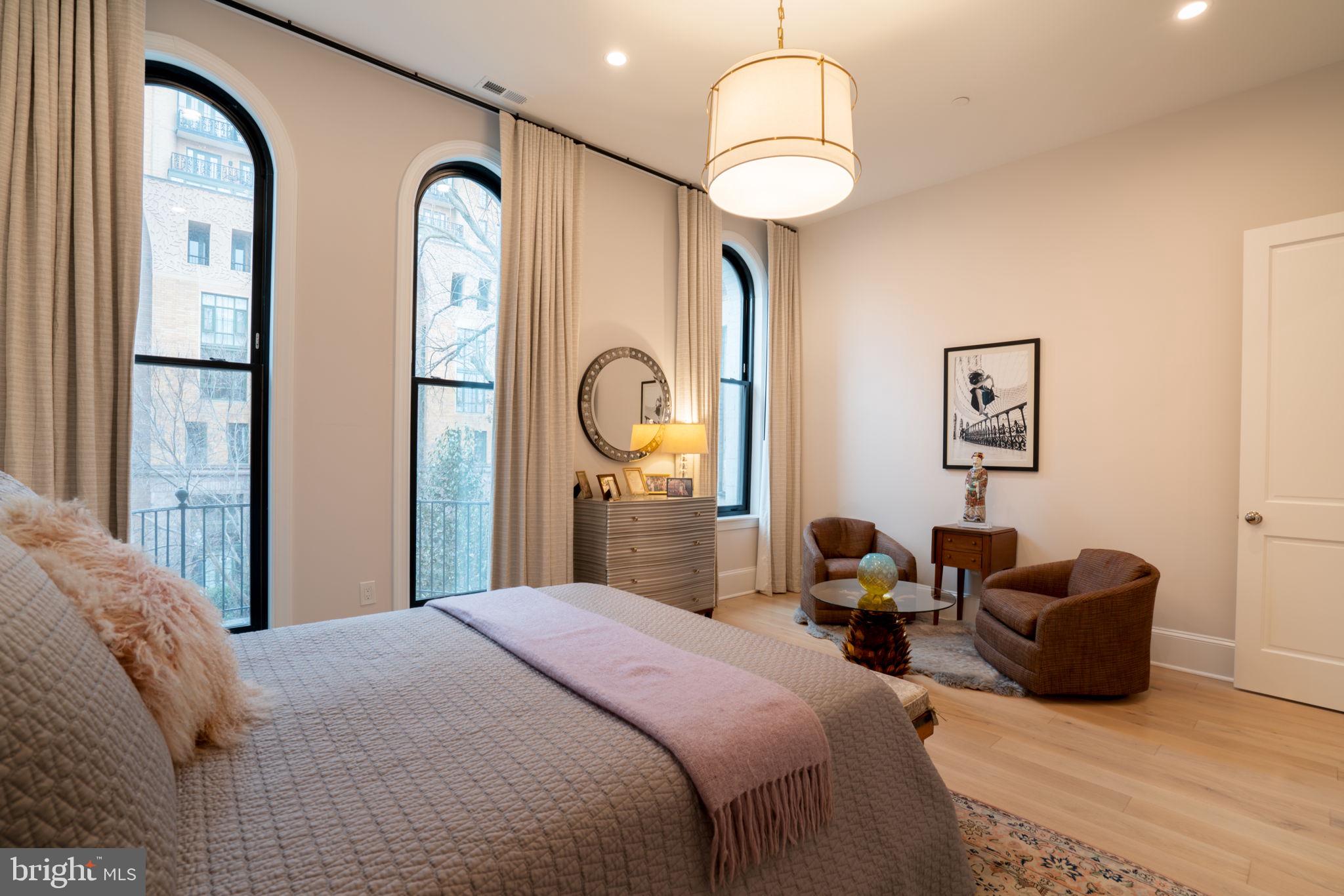 911 M Street Northwest Washington, DC 20001 - Photo 13 of 31 a bedroom with bed and a chandelier