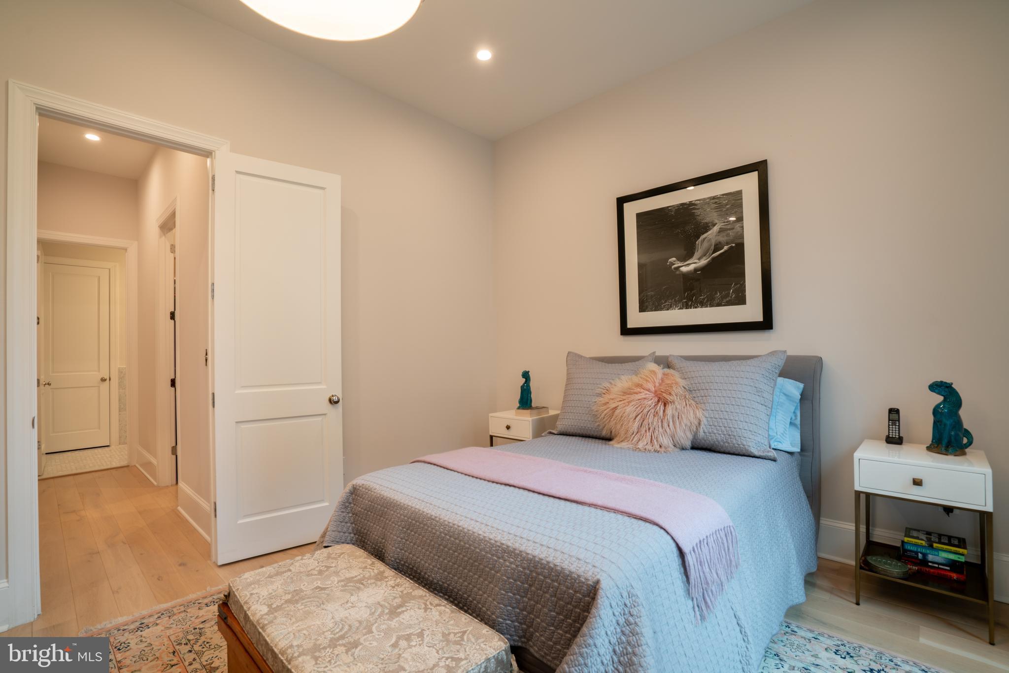 911 M Street Northwest Washington, DC 20001 - Photo 14 of 31 a bedroom with a bed and a painting on the wall