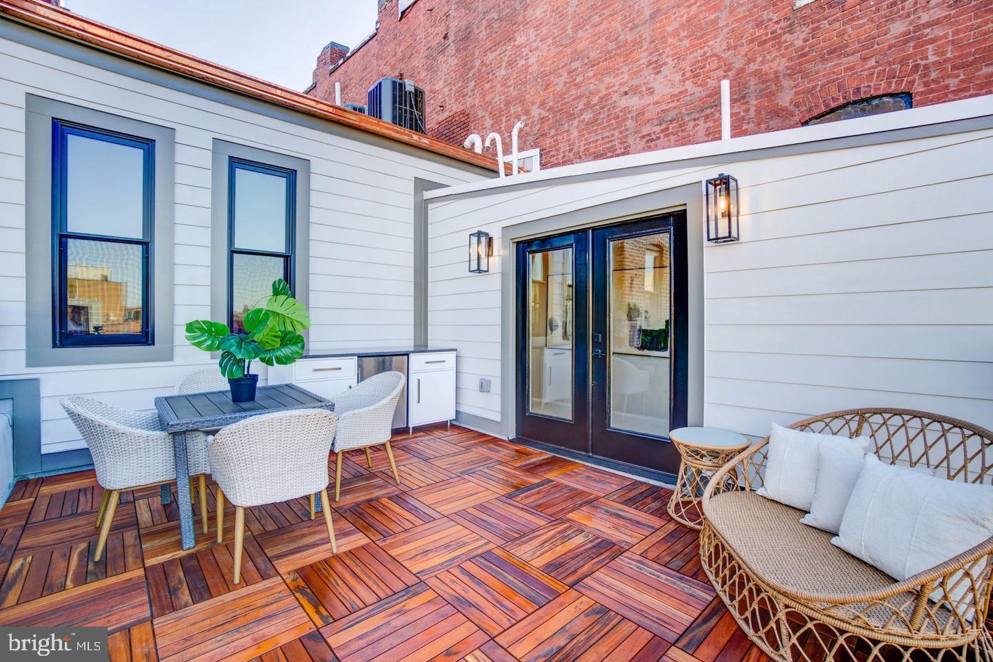 911 M Street Northwest Washington, DC 20001 - Photo 27 of 31 a balcony with table and chairs