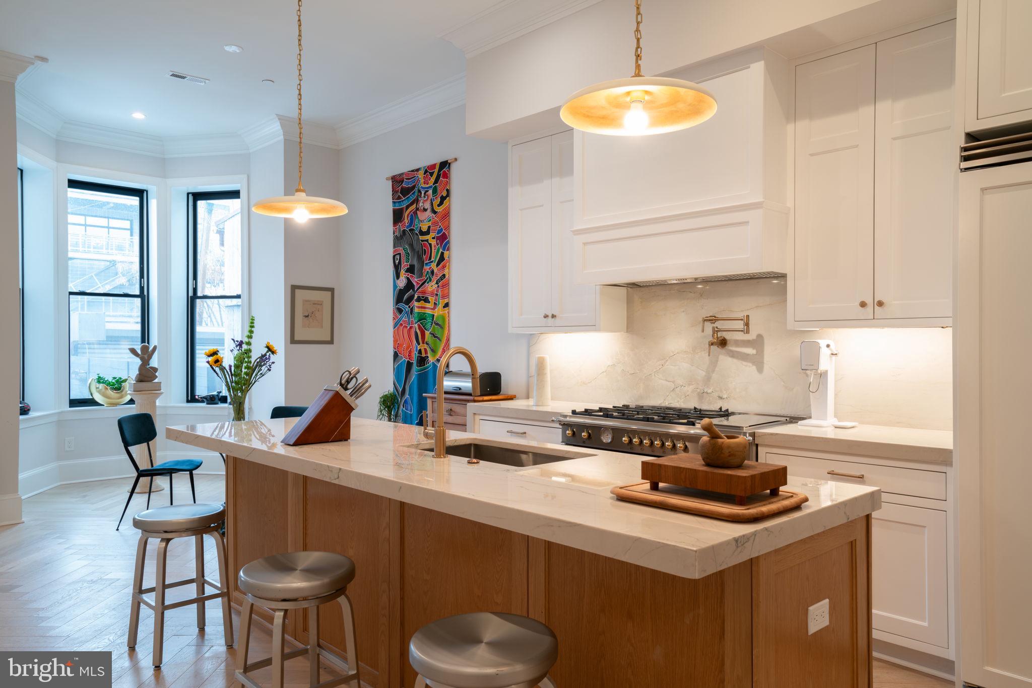 911 M Street Northwest Washington, DC 20001 - Photo 6 of 31 a kitchen with a sink cabinets and window