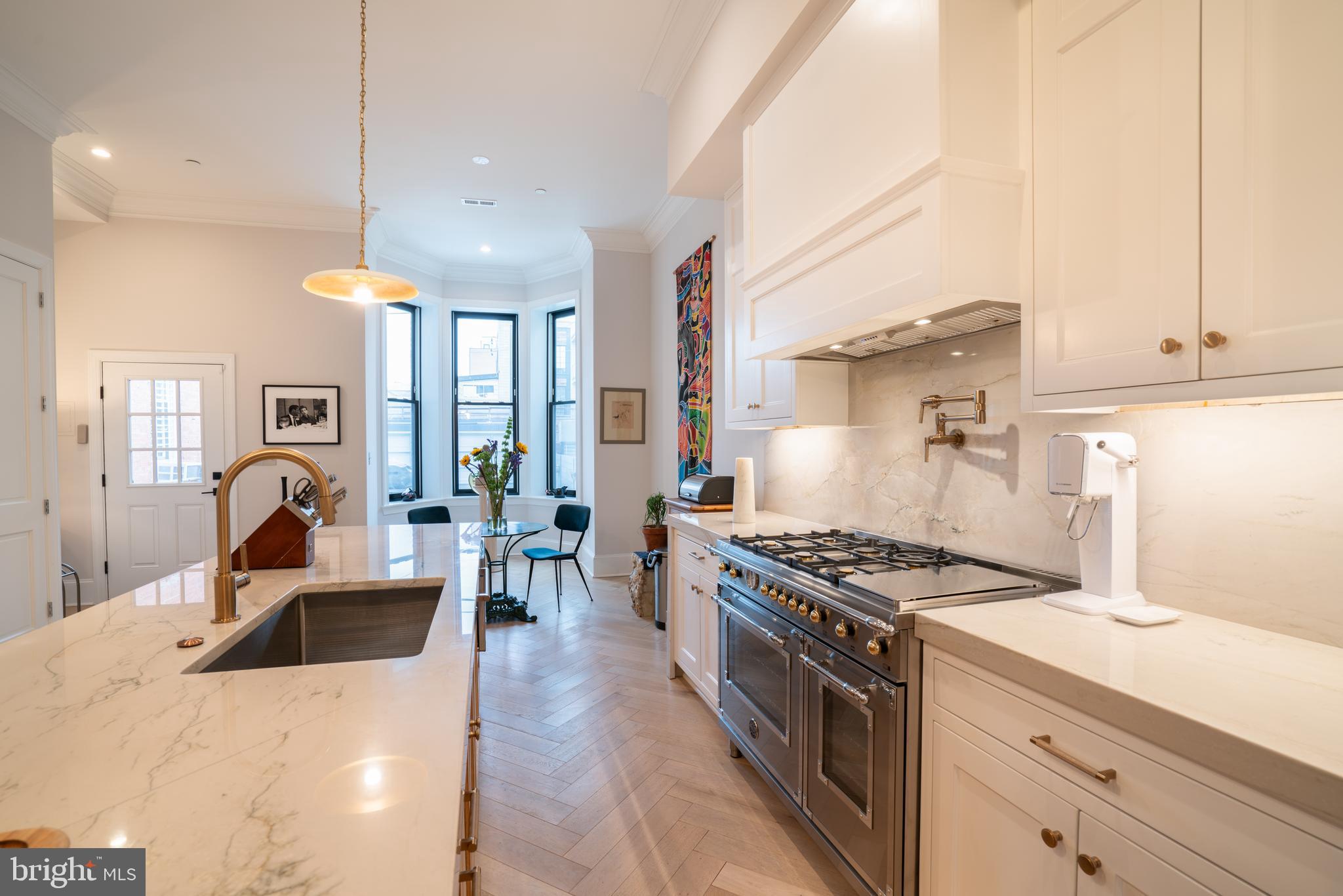 911 M Street Northwest Washington, DC 20001 - Photo 8 of 31 a kitchen with stove a sink and cabinets