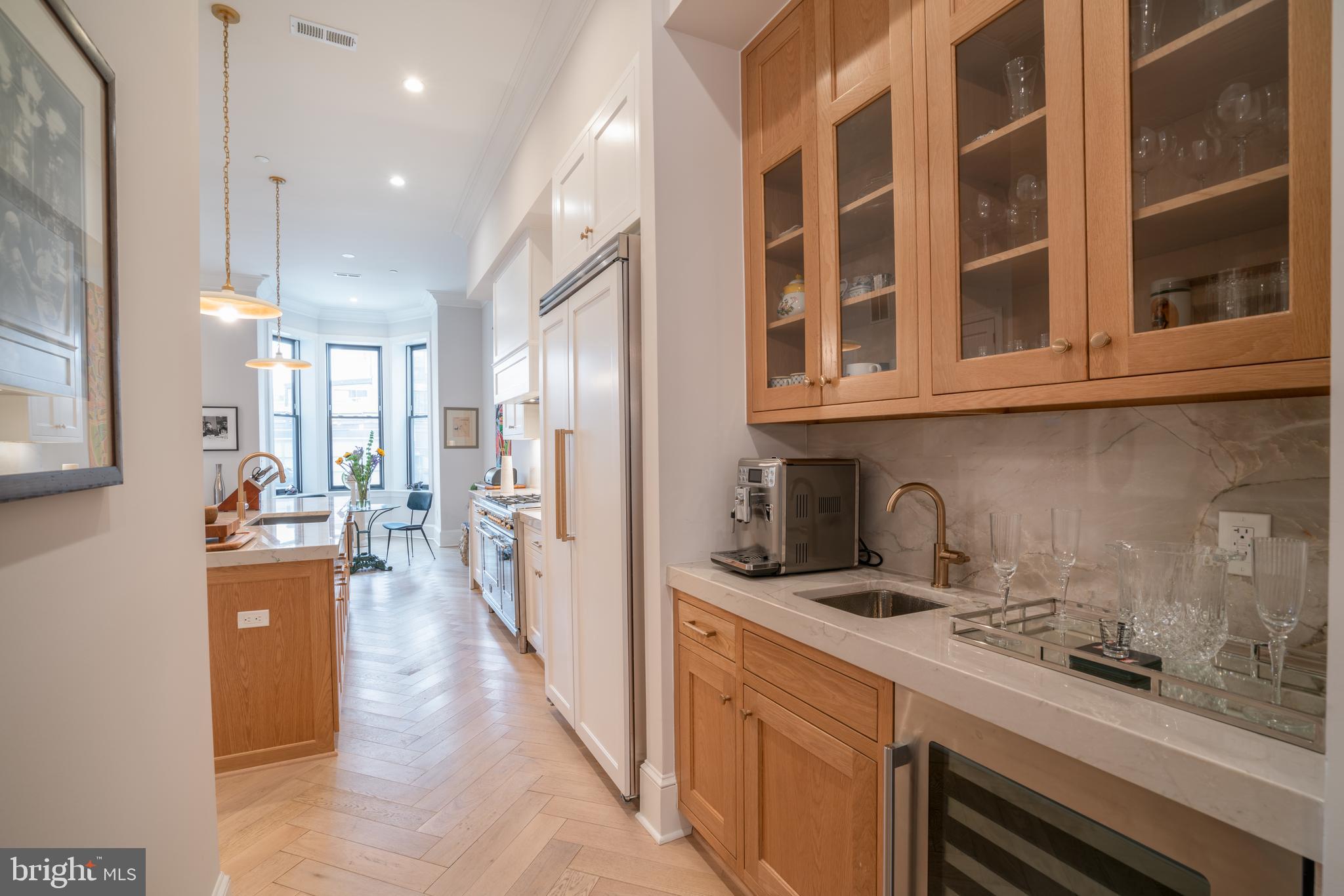 911 M Street Northwest Washington, DC 20001 - Photo 9 of 31 a kitchen with stainless steel appliances granite countertop a sink and cabinets