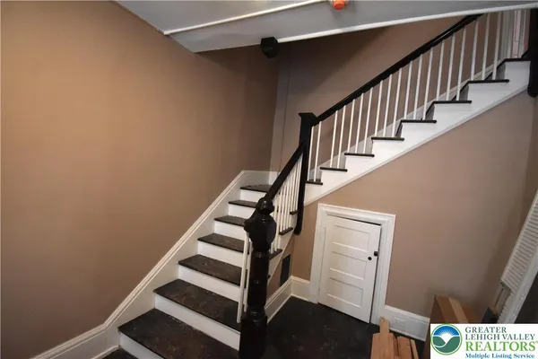 a view of entryway with wooden floor