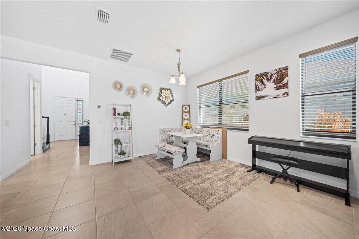 3235 Hummingbird Way Melbourne, FL 32940 - Photo 12 of 31 a bedroom with furniture and a window