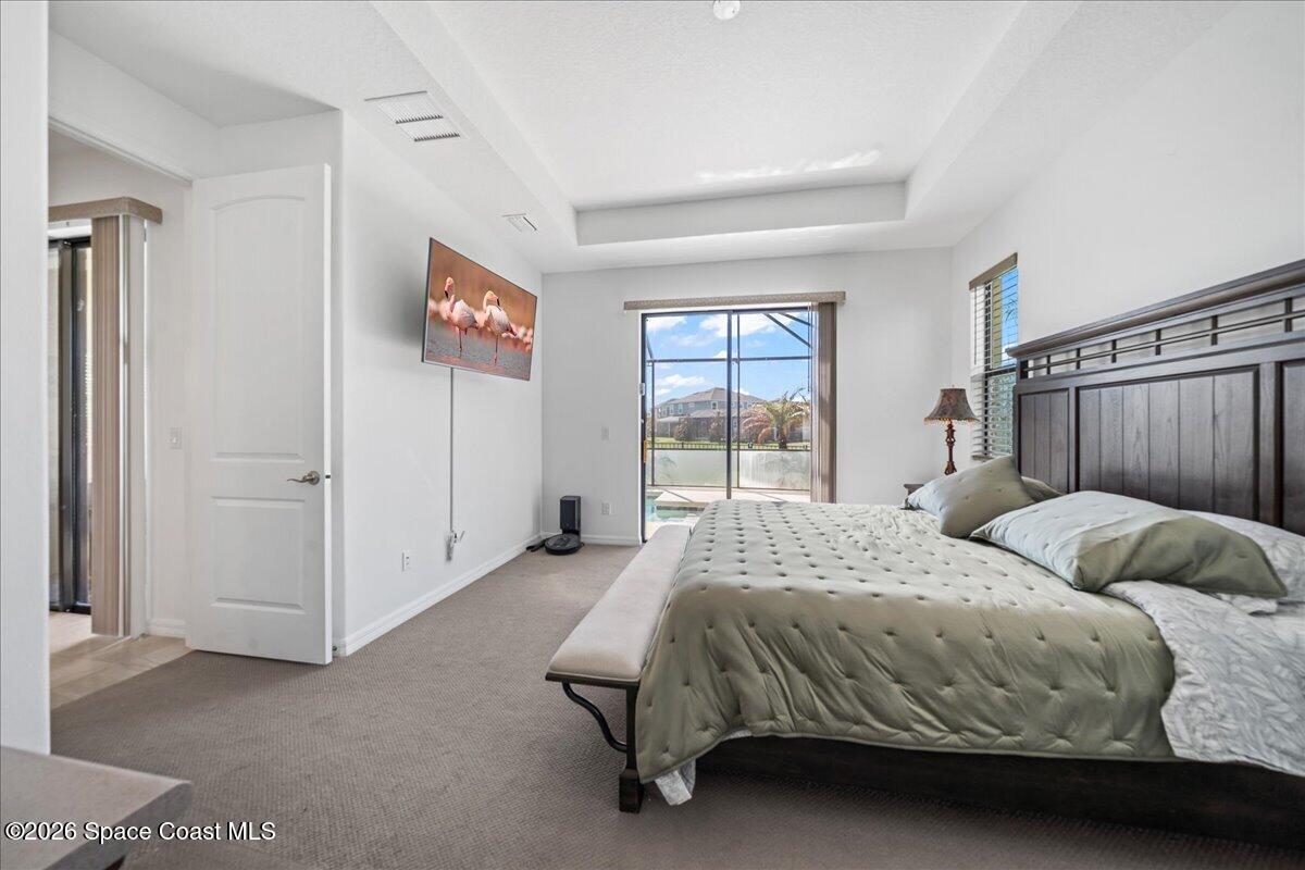 3235 Hummingbird Way Melbourne, FL 32940 - Photo 15 of 31 a bedroom with a bed and a window