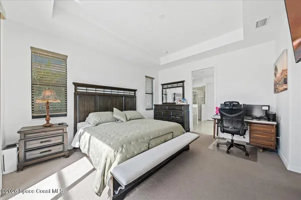 a bedroom with a bed and furniture