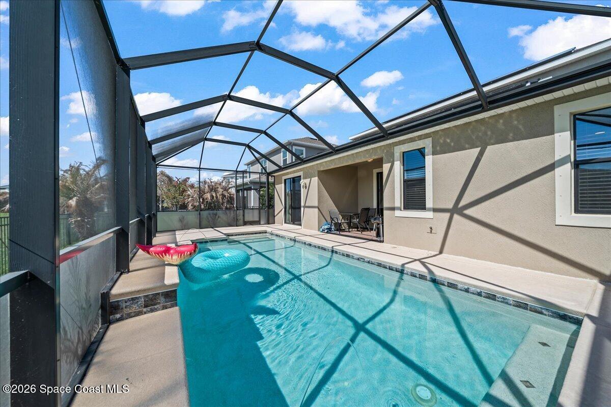3235 Hummingbird Way Melbourne, FL 32940 - Photo 27 of 31 a view of a chairs and table in the balcony