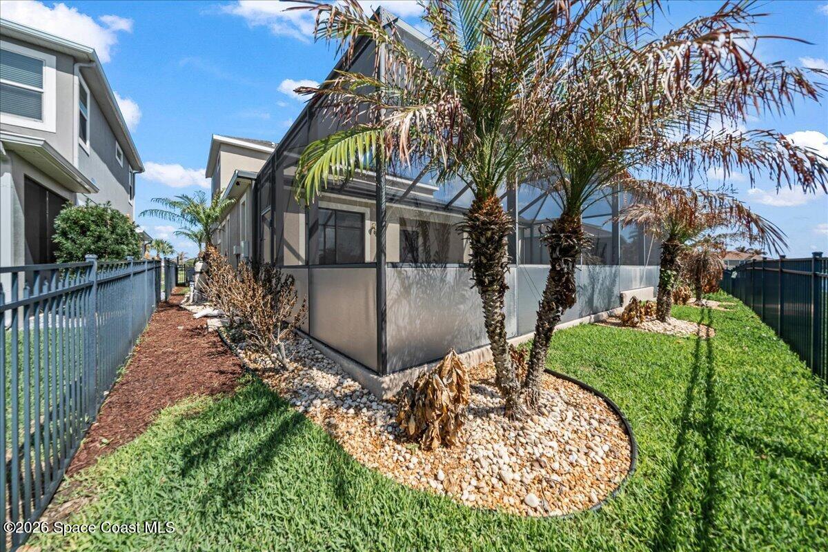 3235 Hummingbird Way Melbourne, FL 32940 - Photo 28 of 31 a view of a house with backyard and sitting area