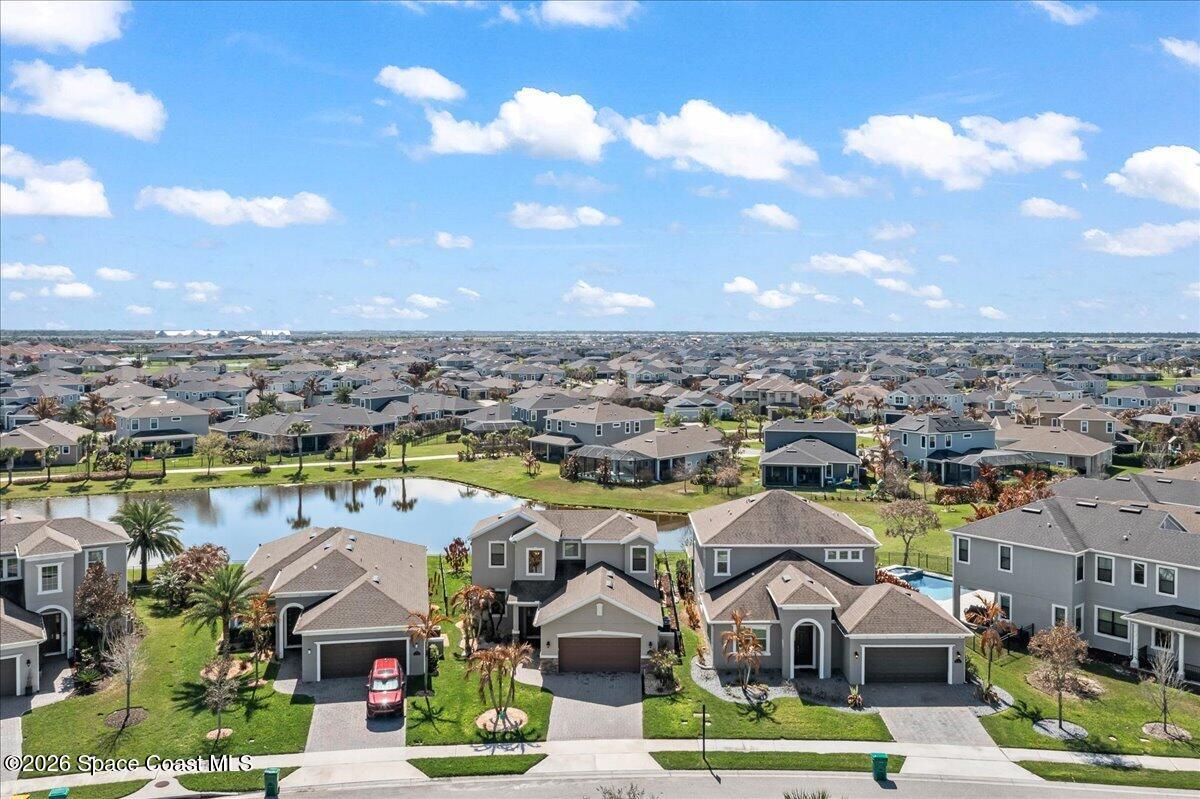 3235 Hummingbird Way Melbourne, FL 32940 - Photo 30 of 31 an aerial view of residential houses with outdoor space and lake view