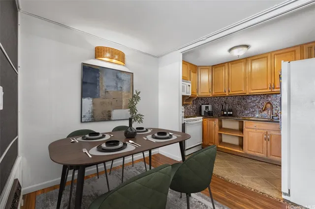 a kitchen with stainless steel appliances kitchen island granite countertop a stove a sink and a refrigerator