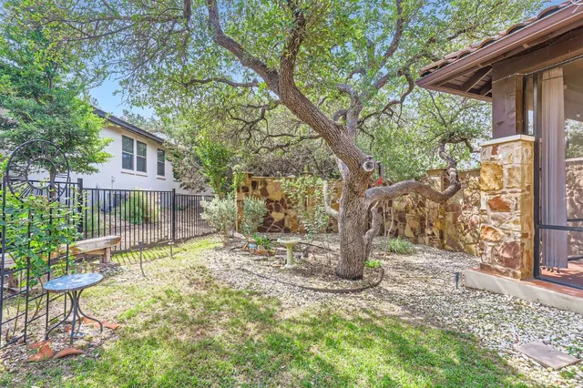 a view of a yard with a tree