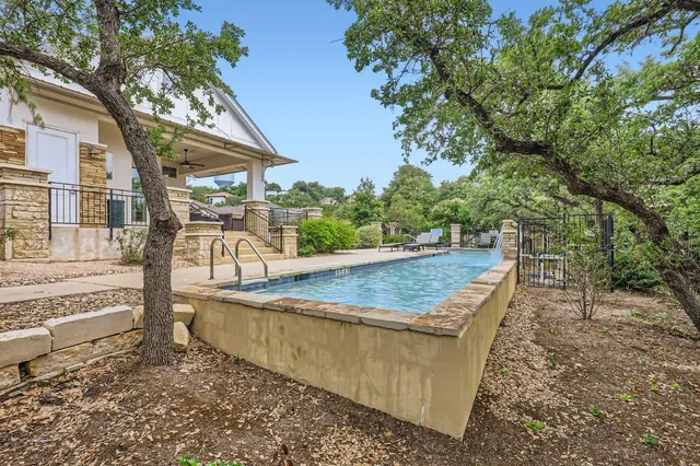 a view of a house with swimming pool