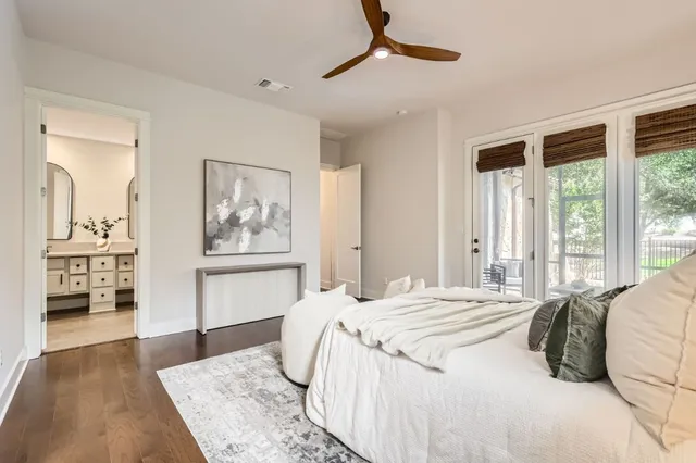 a bedroom with a large bed and a window