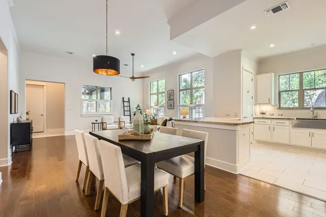 a large kitchen with a table and chairs