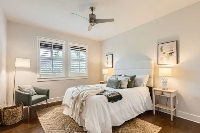 a bedroom with bed and a couch