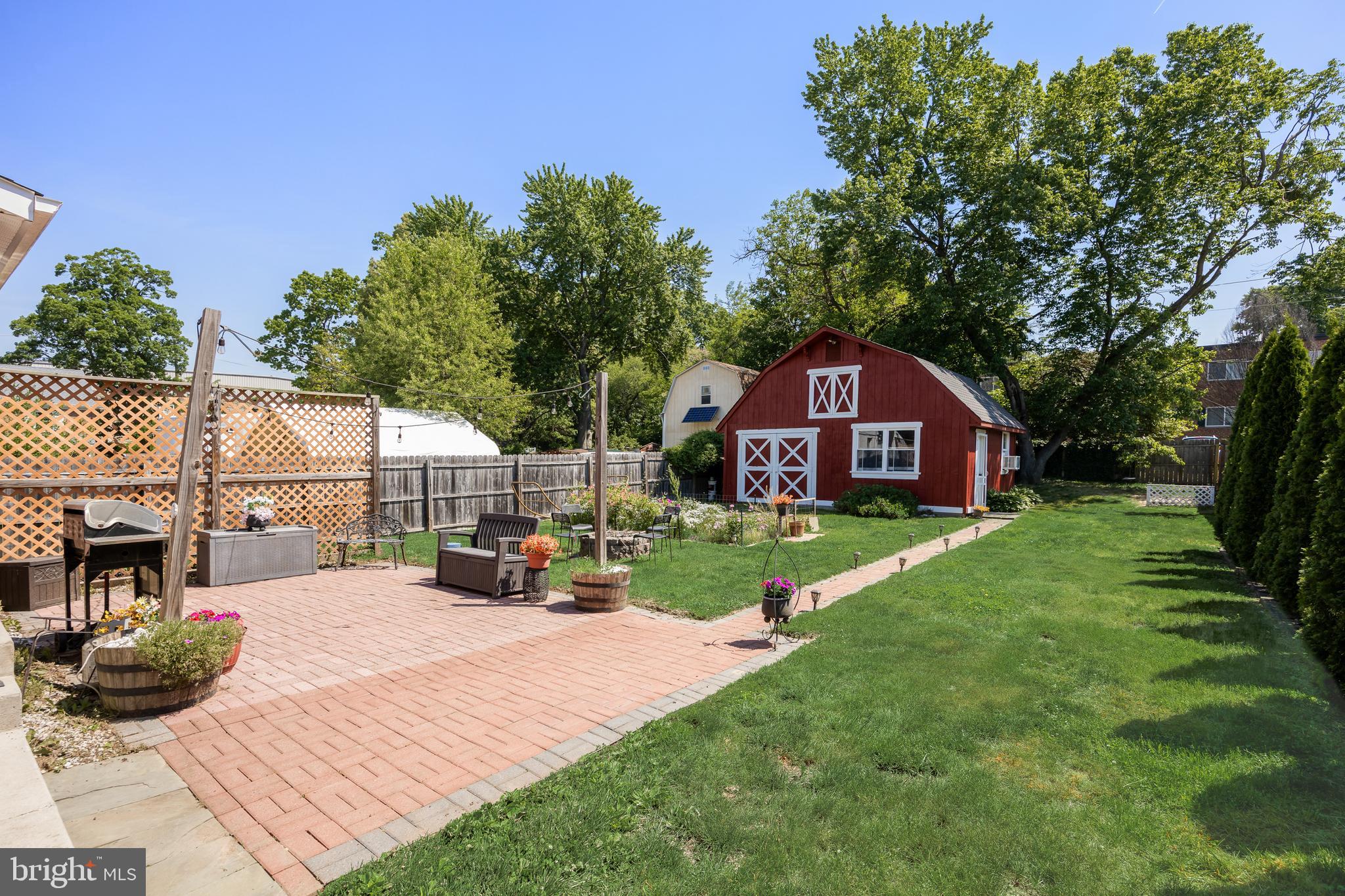615 North Walnut Avenue Magnolia, NJ 08049 - Photo 29 of 40 a view of a house with backyard and sitting area