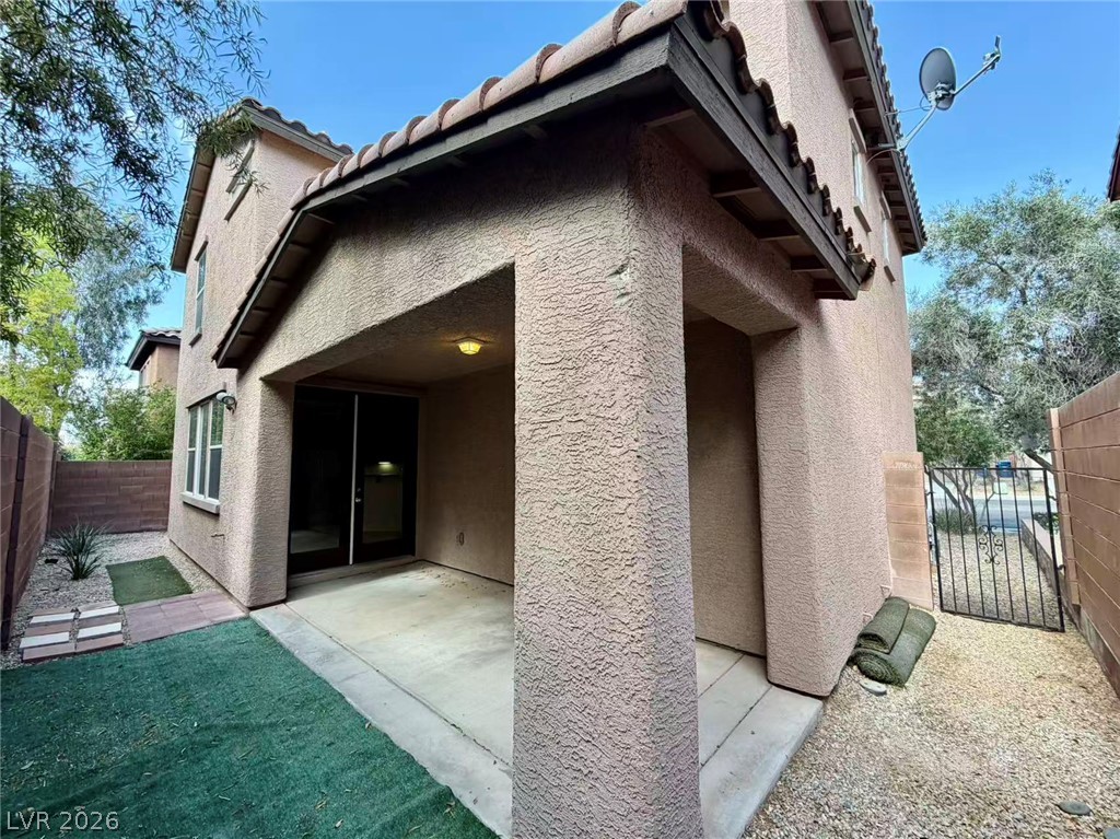 11183 Ranch Valley Street Las Vegas, NV 89179 - Photo 19 of 19 An inviting covered patio offers seamless indoor-outdoor living to this residential exterior.