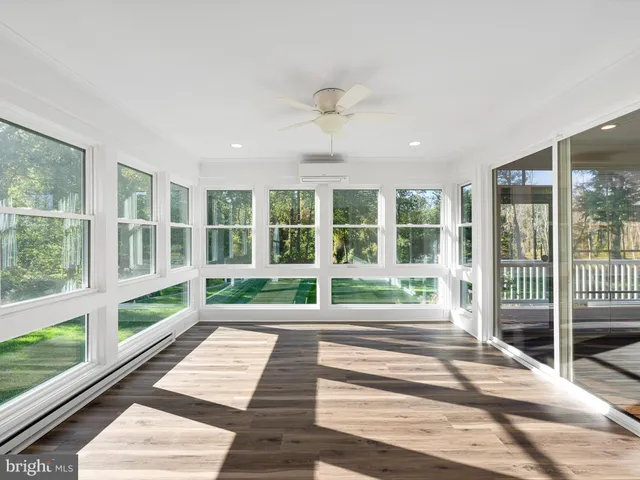 a view of a room with wooden floor and balcony