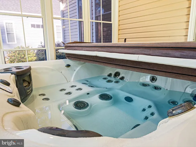 a bathroom with a bathtub and a window