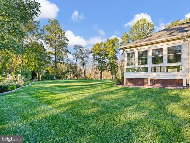 a front view of a building with a garden