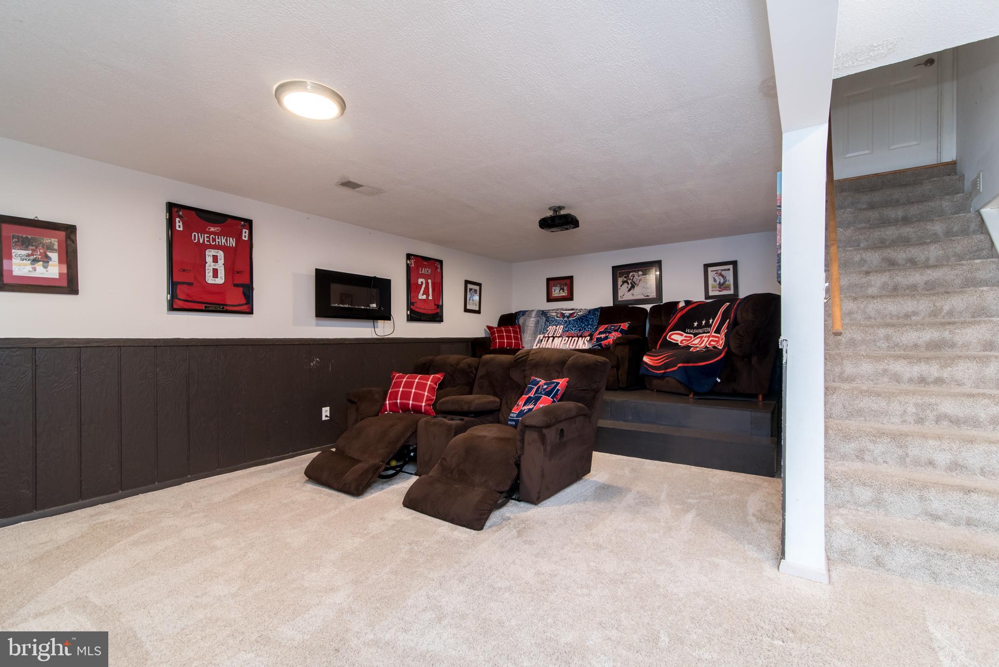 8235 Hilton Road Gaithersburg, MD 20882 - Photo 53 of 90 Home theatre w/ wainscoting- lower level