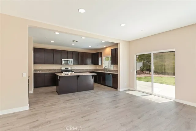a kitchen with a sink stove and microwave