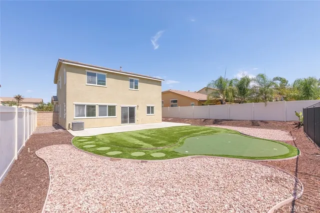 an aerial view of residential houses with outdoor space and city view