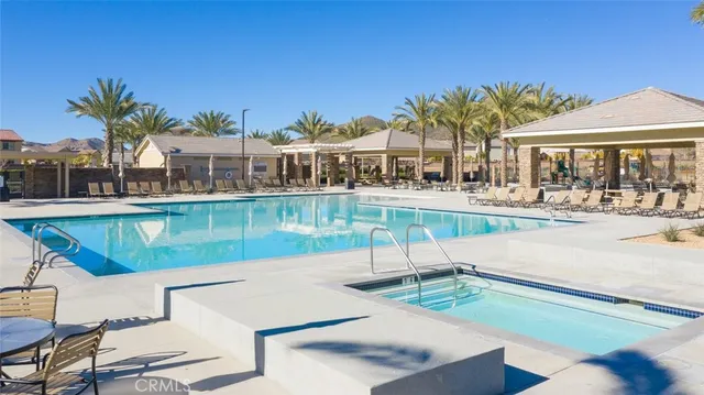 a view of a swimming pool with a lake view and mountain view
