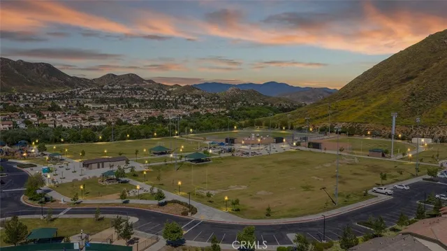 a view of a house with pool table and chairs