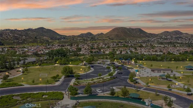 an aerial view of a house with a garden and swimming pool