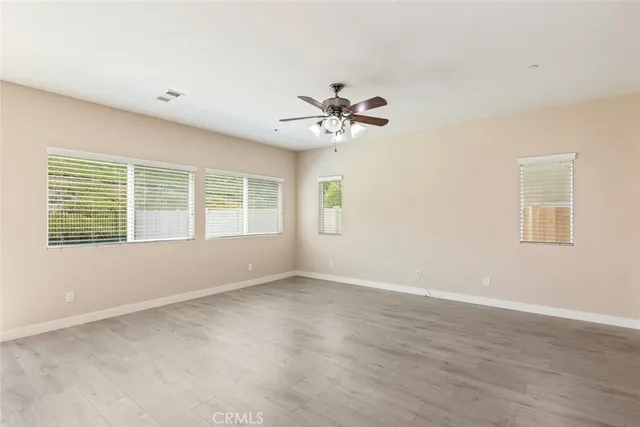 a view of kitchen with a sink and a refrigerator