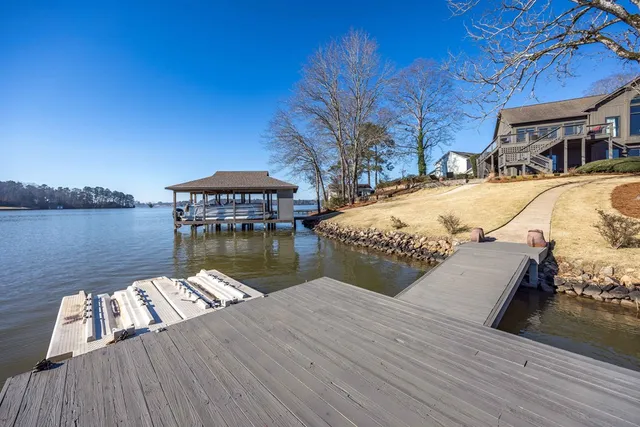 a view of a yard with a house in the background
