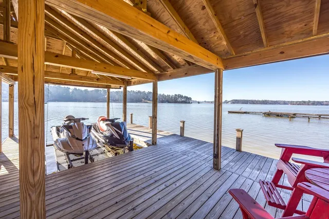 a large kitchen with granite countertop a counter space and stainless steel appliances