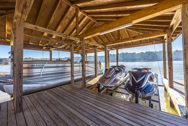 a kitchen with granite countertop a stove and a microwave