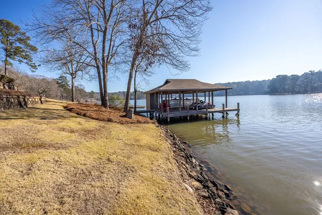 a view of a dining room with furniture wooden floor and chandelier