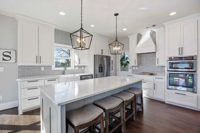 a bathroom with a sink a mirror and a bathtub