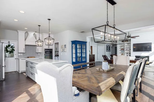 a living room with fireplace furniture and a flat screen tv