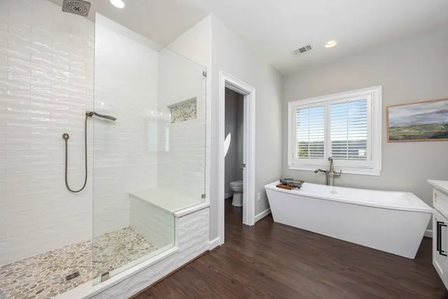 a view of a lake with table and chairs