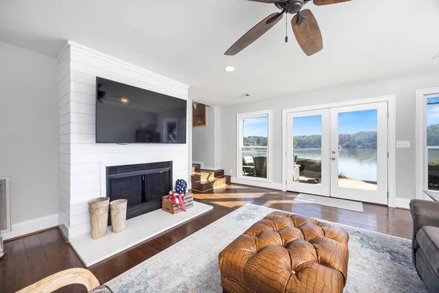a view of a room with furniture and floor to ceiling window