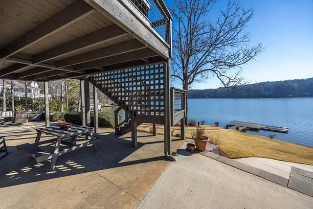 a view of a lake with a tree in the background