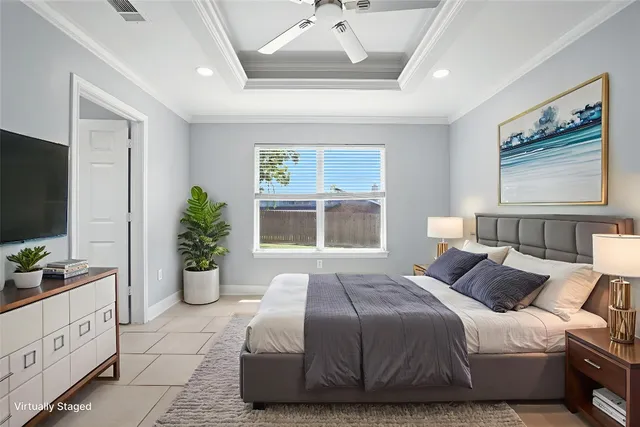 a bedroom with bed and a flat tv screen