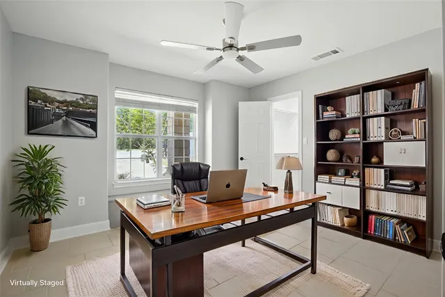 a view of a workspace with furniture and a potted plant