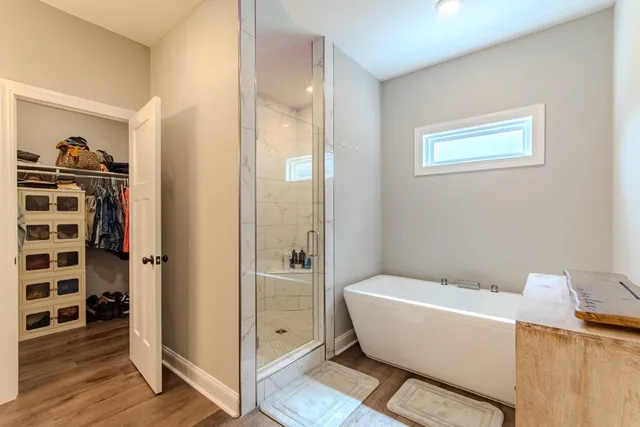 a bathroom with a bathtub and a shower