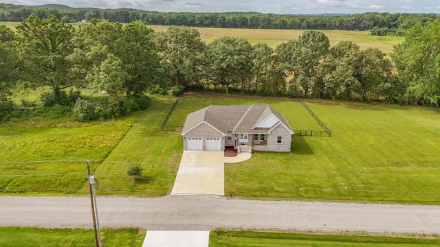 a view of a lake with a yard