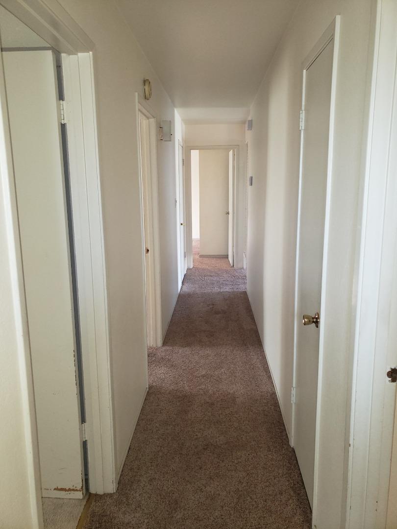 562 Leslie Drive Salinas, CA 93906 - Photo 11 of 21 a view of a hallway with a wooden door