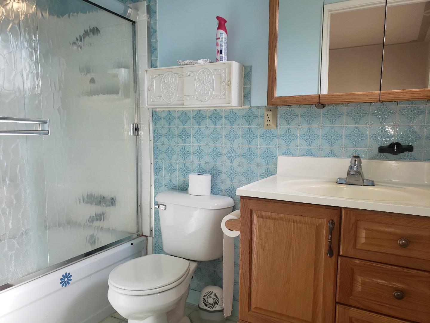 562 Leslie Drive Salinas, CA 93906 - Photo 13 of 21 a bathroom with a sink toilet and shower