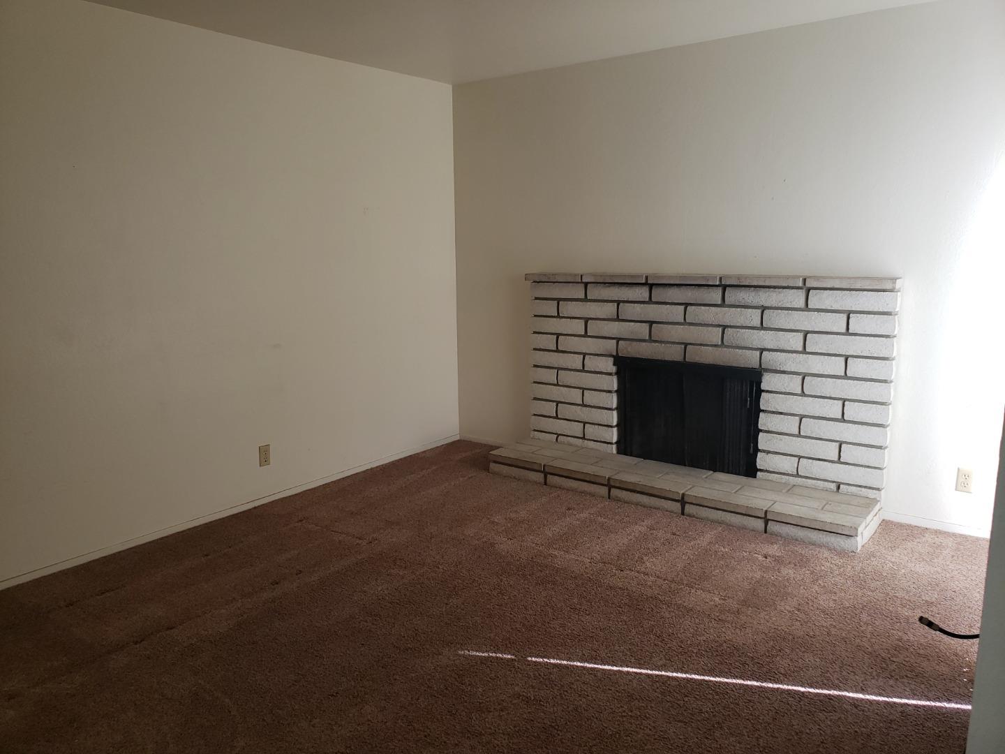 562 Leslie Drive Salinas, CA 93906 - Photo 17 of 21 an empty room with a fireplace