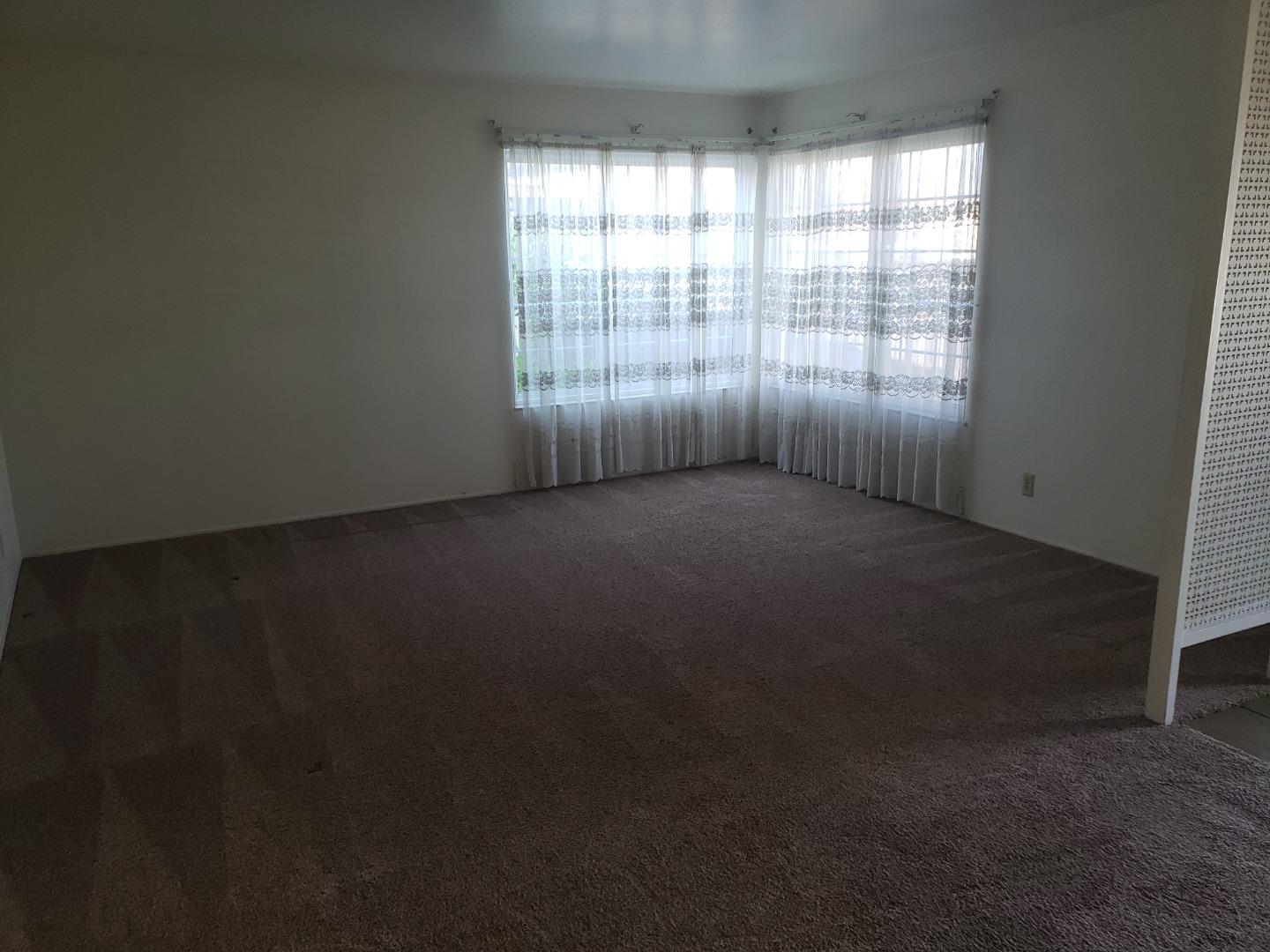 562 Leslie Drive Salinas, CA 93906 - Photo 4 of 21 an empty room with a window
