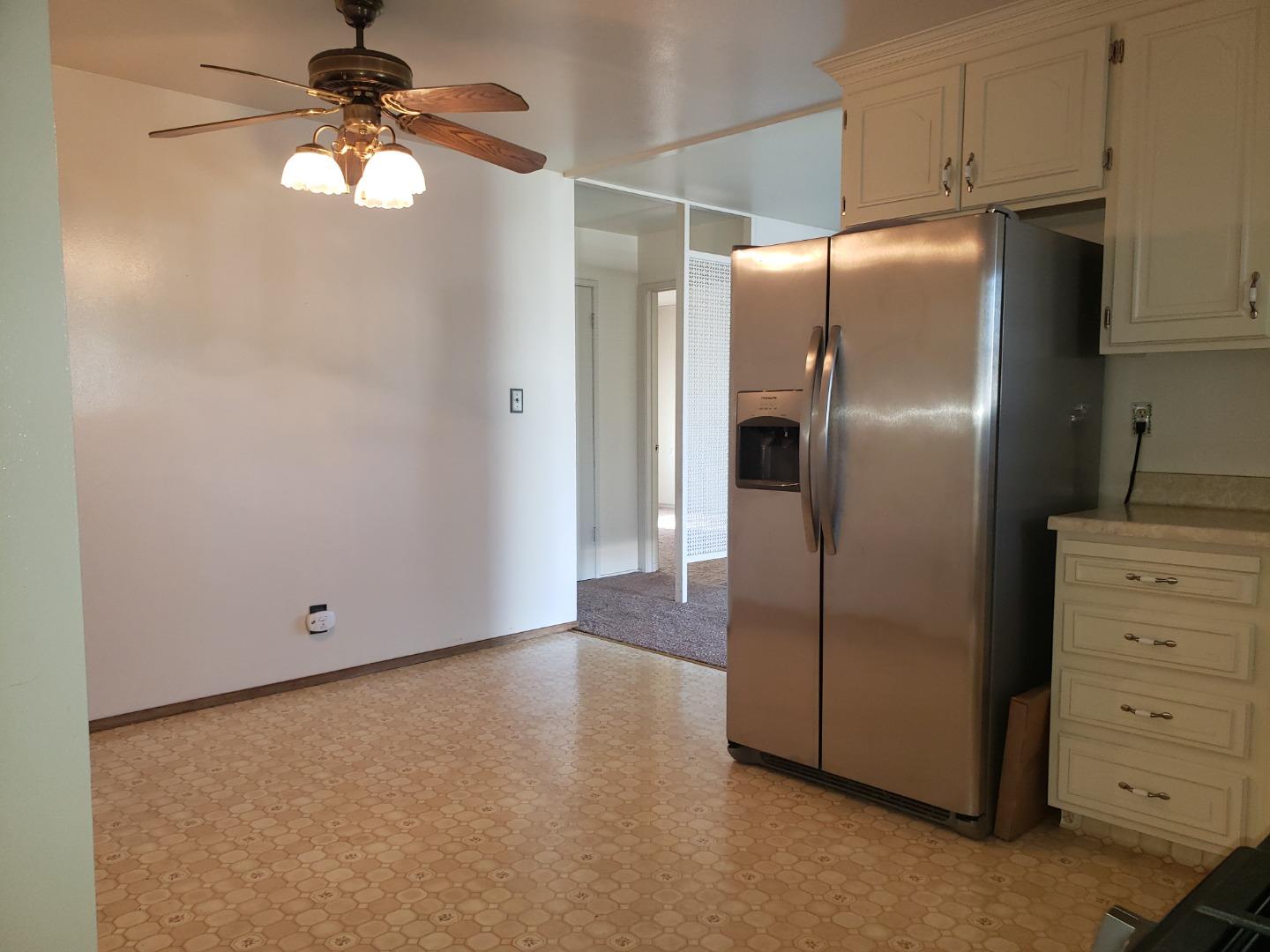 562 Leslie Drive Salinas, CA 93906 - Photo 10 of 21 a kitchen with stainless steel appliances a refrigerator and cabinets